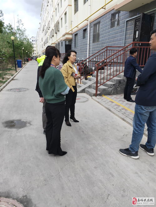 敦煌市房地產管理局調研組 深入陽光家園小區了解電動車充電樁建設